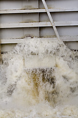 Image showing Water pouring out of canal lock