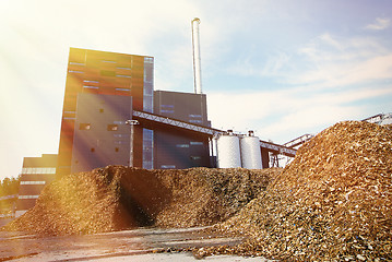 Image showing bio power plant with storage of wooden fuel (biomass) against bl