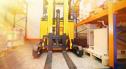 Image showing Forklift, shelves and racks with pallets in distribution warehou