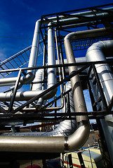 Image showing Industrial zone, Steel pipelines and valves against blue sky