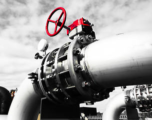 Image showing Industrial zone, Steel pipelines and valves against blue sky