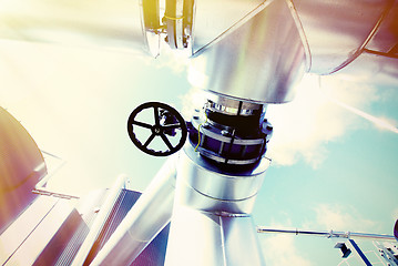 Image showing Industrial zone, Steel pipelines and valves against blue sky