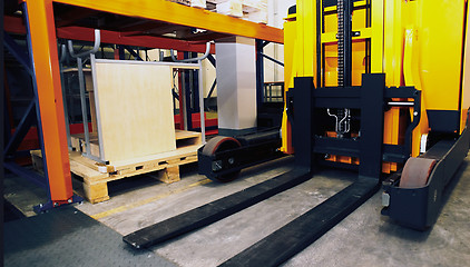 Image showing Shelves, racks and forklift  with pallets in distribution wareho