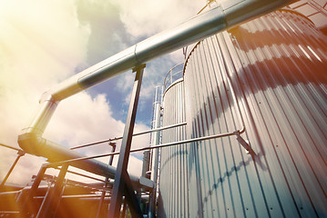 Image showing Industrial zone, Steel pipelines and valves against blue sky