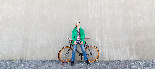 Image showing happy young hipster man with fixed gear bike