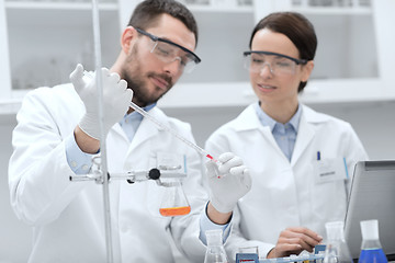 Image showing young scientists making test or research in lab