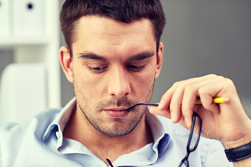 Image showing portrait of businessman with eyeglasses at office