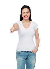 Image showing happy womanin white t-shirt showing thumbs up