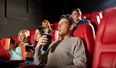 Image showing friends watching horror movie in theater