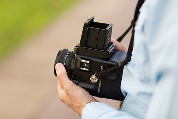 Image showing close up of male photographer with digital camera