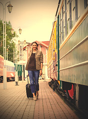 Image showing beautiful middle-aged woman with a luggage