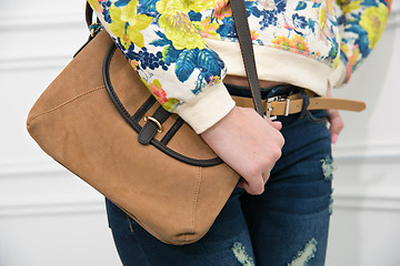 Image showing girl holding a bag. closeup