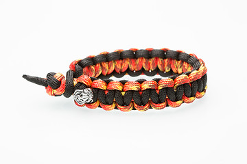 Image showing black and orange braided bracelet on white background