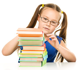 Image showing Little girl with books