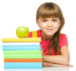 Image showing Little girl with her books