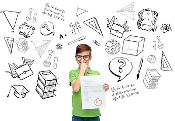 Image showing happy boy in eyeglasses holding school test result