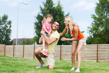 Image showing happy family hugging outdoors