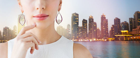 Image showing close up of beautiful woman face with earrings