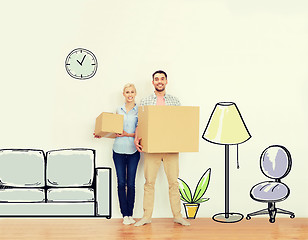 Image showing couple with cardboard boxes moving to new home