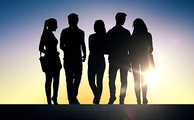 Image showing silhouettes of students on stairs over sun