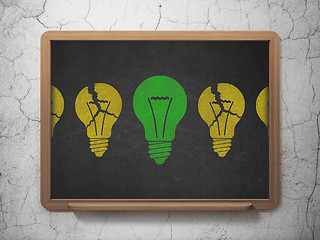 Image showing Business concept: light bulb icon on School board background