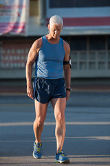 Image showing portrait of handsome senior jogging man