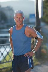 Image showing portrait of handsome senior jogging man