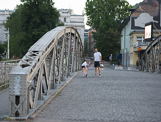 Image showing couple warming up and stretching before jogging