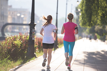 Image showing female friends jogging