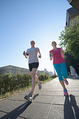 Image showing female friends jogging