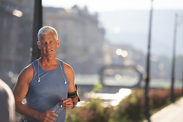 Image showing portrait of handsome senior jogging man