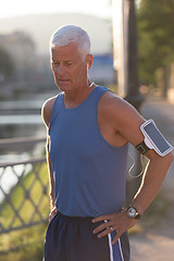 Image showing portrait of handsome senior jogging man