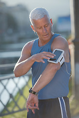 Image showing portrait of handsome senior jogging man