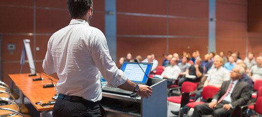 Image showing Public speaker giving talk at Business Event.