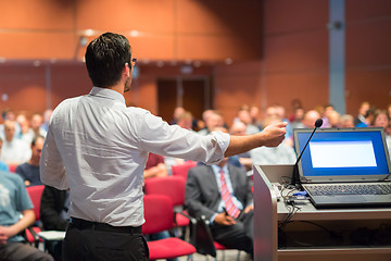 Image showing Public speaker giving talk at Business Event.