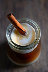 Image showing Cup of espresso and cinnamon stick