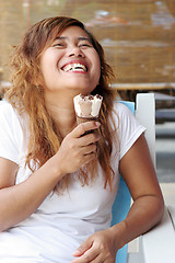 Image showing Laughing and eating icecream