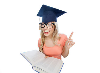 Image showing student woman in mortarboard with encyclopedia