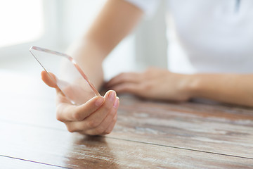 Image showing close up of woman with transparent smartphone