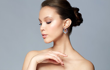 Image showing close up of beautiful woman face with earring