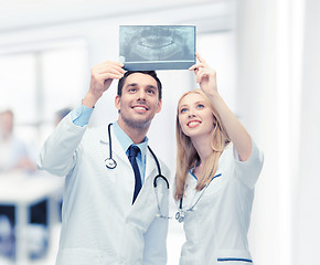 Image showing two doctors looking at x-ray