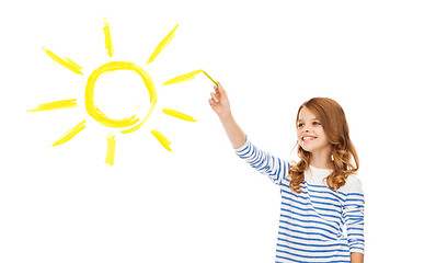 Image showing girl drawing big sun in the air