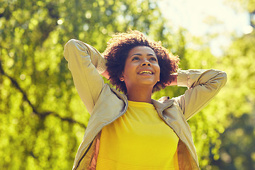 Image showing happy african american young woman in summer park