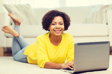 Image showing happy african american woman with laptop at home