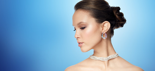 Image showing close up of beautiful woman face with earring