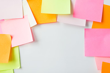 Image showing close up of blank paper stickers on cork board