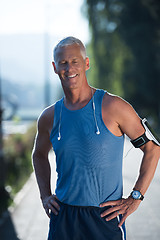 Image showing portrait of handsome senior jogging man