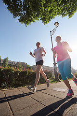 Image showing female friends jogging