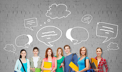 Image showing group of teenage students with folders and bags