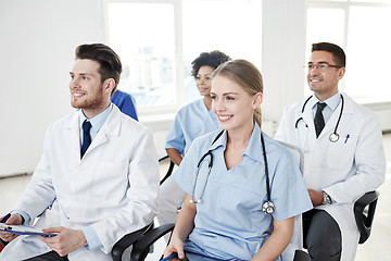 Image showing group of happy doctors on seminar at hospital